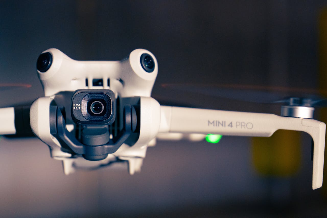 Services Detailed view of a Mini 4 Pro drone showcasing its technology and design.